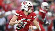 Sep 5, 2025; Louisville, Kentucky, USA;  Louisville Cardinals quarterback Miller Moss (7) looks to pass against the James Madison Dukes during the first quarter at L&N Federal Credit Union Stadium. Mandatory Credit: Jamie Rhodes-Imagn Images