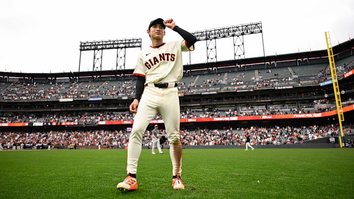 Sep 28, 2025; San Francisco, California, USA;  San Francisco Giants center fielder Jung Hoo Lee (51) stands on the field after the game against the Colorado Rockies at Oracle Park. Mandatory Credit: Eakin Howard-Imagn Images