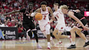 Wisconsin guard Nick Boyd (2) drives past Southern Illinois-Edwardsville forward Arnas Sakenis (34) during the second half of their game Monday, November 17, 2025 at the Kohl Center in Madison, Wisconsin. Wisconsin beat Southern Illinois-Edwardsville 94-69.