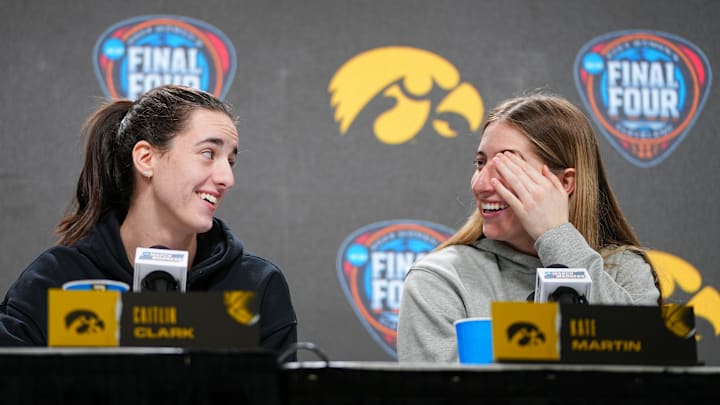 Iowa Hawkeyes guard Caitlin Clark (22) and Iowa Hawkeyes guard Kate Martin (20) take questions at Rocket Mortgage Arena. Iowa Hawkeyes guard Caitlin Clark (22) and Iowa Hawkeyes guard Kate Martin (20) take questions at Rocket Mortgage Arena.