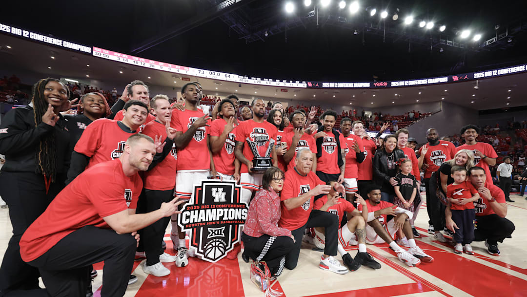 Mar 1, 2025; Houston, Texas, USA; The Houston Cougars  celebrate winning the Big 12 Conference after defeating the Cincinnati Bearcats at Fertitta Center. Mandatory Credit: Thomas Shea-Imagn Images