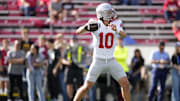 Oct 18, 2025; Madison, Wisconsin, USA; Ohio State Buckeyes quarterback Julian Sayin (10) warms up before the game against the Wisconsin Badgers at Camp Randall Stadium. Mandatory Credit: Jeff Hanisch-Imagn Images