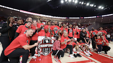 Mar 1, 2025; Houston, Texas, USA; The Houston Cougars  celebrate winning the Big 12 Conference after defeating the Cincinnati Bearcats at Fertitta Center. Mandatory Credit: Thomas Shea-Imagn Images