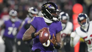 Jan 20, 2024; Baltimore, MD, USA; Baltimore Ravens quarterback Lamar Jackson (8) rolls out to throw against the Houston Texans during the second quarter of a 2024 AFC divisional round game at M&T Bank Stadium. Mandatory Credit: Mitch Stringer-USA TODAY Sports