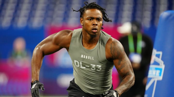 Feb 29, 2024; Indianapolis, IN, USA; Michigan defensive lineman Jaylen Harrell (DL33) works out during the 2024 NFL Combine at Lucas Oil Stadium. Mandatory Credit: Kirby Lee-USA TODAY Sports