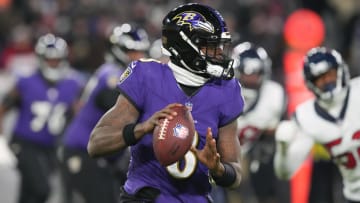 Jan 20, 2024; Baltimore, MD, USA; Baltimore Ravens quarterback Lamar Jackson (8) rolls out to throw against the Houston Texans during the second quarter of a 2024 AFC divisional round game at M&T Bank Stadium.