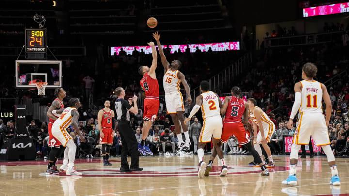 Dec 11, 2022; Atlanta, Georgia, USA; Chicago Bulls center Nikola Vucevic (9) and Atlanta Hawks center Clint Capela (15) tip off the overtime at State Farm Arena. Mandatory Credit: Dale Zanine-USA TODAY Sports