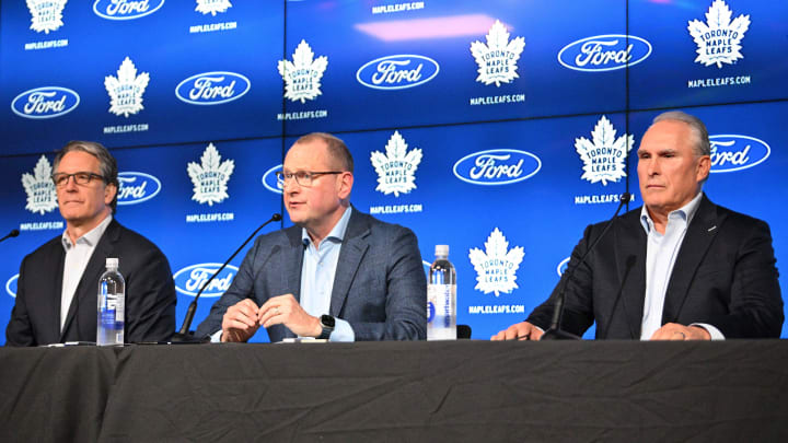 May 21, 2024; Toronto, Ontario, CANADA;  Toronto Maple Leafs general manager Brad Treliving (center) and team president Brendan Shanahan (left) introduce new head coach Craig Berube at Ford Performance Centre. Mandatory Credit: Dan Hamilton-USA TODAY Sports