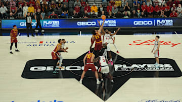 Nov 24, 2025; Las Vegas, Nevada, USA; Iowa State Cyclones forward Blake Buchanan (23) and St. John's Red Storm forward Zuby Ejiofor (24) battle for control of the ball during a tipoff during the first half in a 2025 Players Era Festival group play game at Michelob Ultra Arena. 