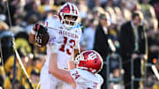 Indiana wide receiver Elijah Sarratt (13) celebrates with offensive lineman Bray Lynch.