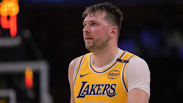 Feb 10, 2025; Los Angeles, California, USA; Los Angeles Lakers guard Luka Doncic (77) looks on from the court against the Utah Jazz at Crypto.com Arena. Mandatory Credit: Jayne Kamin-Oncea-Imagn Images