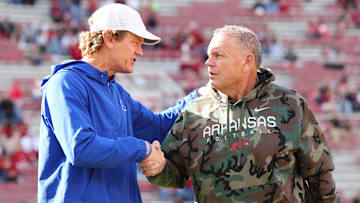 Nov 23, 2024; Fayetteville, Arkansas, USA; Louisiana Tech Bulldogs head coach Sonny Crumbie talks to Arkansas Razorbacks head coach Sam Pittman prior to a game at Donald W. Reynolds Razorback Stadium. Mandatory Credit: Nelson Chenault-Imagn Images