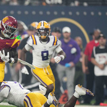 Sep 1, 2024; Paradise, Nevada, USA; Southern California Trojans wide receiver Zachariah Branch (1) carries the ball against LSU Tigers linebacker Harold Perkins Jr. (7) in the first half at Allegiant Stadium.