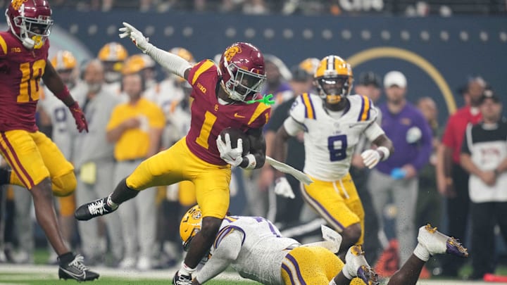 Sep 1, 2024; Paradise, Nevada, USA; Southern California Trojans wide receiver Zachariah Branch (1) carries the ball against LSU Tigers linebacker Harold Perkins Jr. (7) in the first half at Allegiant Stadium.