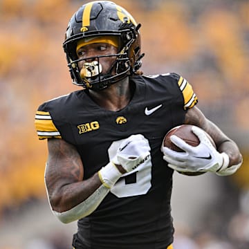 Sep 14, 2024; Iowa City, Iowa, USA; Iowa Hawkeyes running back Jaziun Patterson (9) runs for a 39 yard touchdown against the Troy Trojans during the fourth quarter at Kinnick Stadium. Mandatory Credit: Jeffrey Becker-Imagn Images