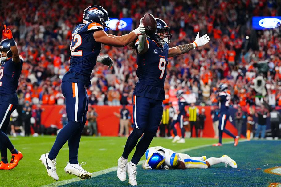 Talanoa Hufanga holds up the ball after an interception.