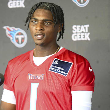 May 10, 2025; Nashville, TN, USA;  Tennessee Titans quarterback Cam Ward (1) talks with reporters after his first day of rookie mini camp  at Saint Thomas Sports Park. Mandatory Credit: Steve Roberts-Imagn Images