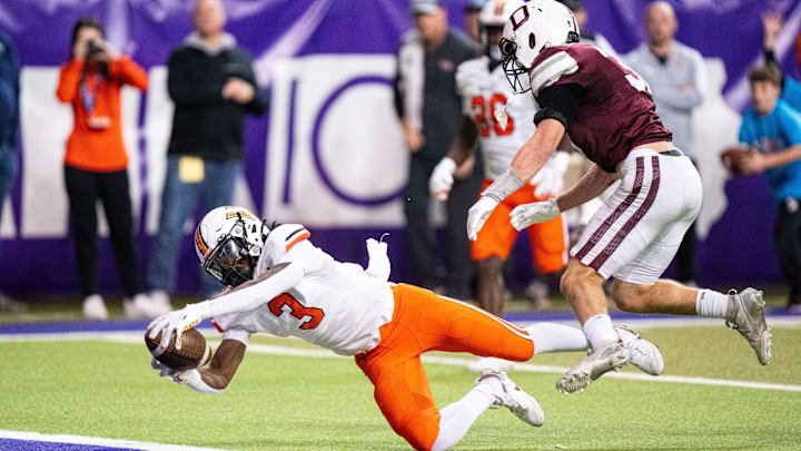 Valley's Zay Robinson (3) reaches for the end zone on Friday, Nov. 15, 2024, at the UNI-Dome in Cedar Falls, IA. Valley's Zay Robinson (3) reaches for the end zone on Friday, Nov. 15, 2024, at the UNI-Dome in Cedar Falls, IA.