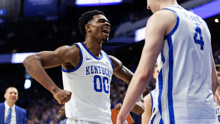 Jan 24, 2026; Lexington, Kentucky, USA; Kentucky Wildcats guard Otega Oweh (00) celebrates with forward Andrija Jelavic (4) during the second half against the Mississippi Rebels at Rupp Arena at Central Bank Center. Mandatory Credit: Jordan Prather-Imagn Images
