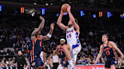 Apr 1, 2025; New York, New York, USA; Philadelphia 76ers forward Alex Reese (65) shoots the ball while being defended by New York Knicks forward OG Anunoby (8) during the second half at Madison Square Garden. Mandatory Credit: John Jones-Imagn Images