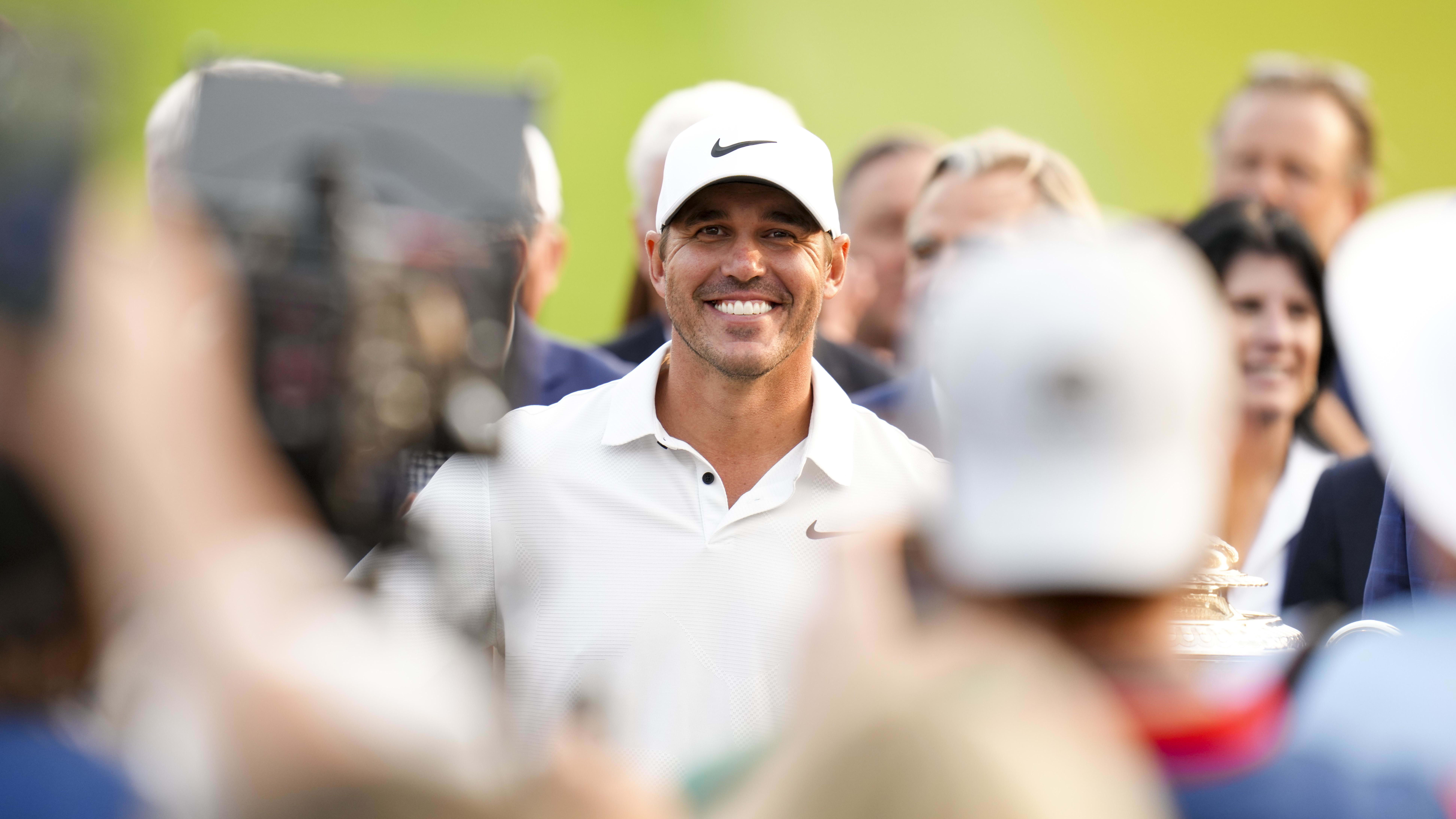 Brooks Koepka stands with the Rodman Wanamaker Trophy after winning the 2023 PGA Championship at Oak Hill.