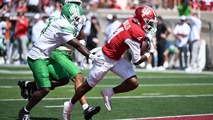 Sep 5, 2026; Bloomington, Indiana, USA;  Indiana Hoosiers wide receiver Davion Chandler (4) runs after the catch for a touchdown against the North Texas Mean Green during the fourth quarter at Merchants Bank Field at Memorial Stadium.  Mandatory Credit: Robert Goddin-Imagn Images