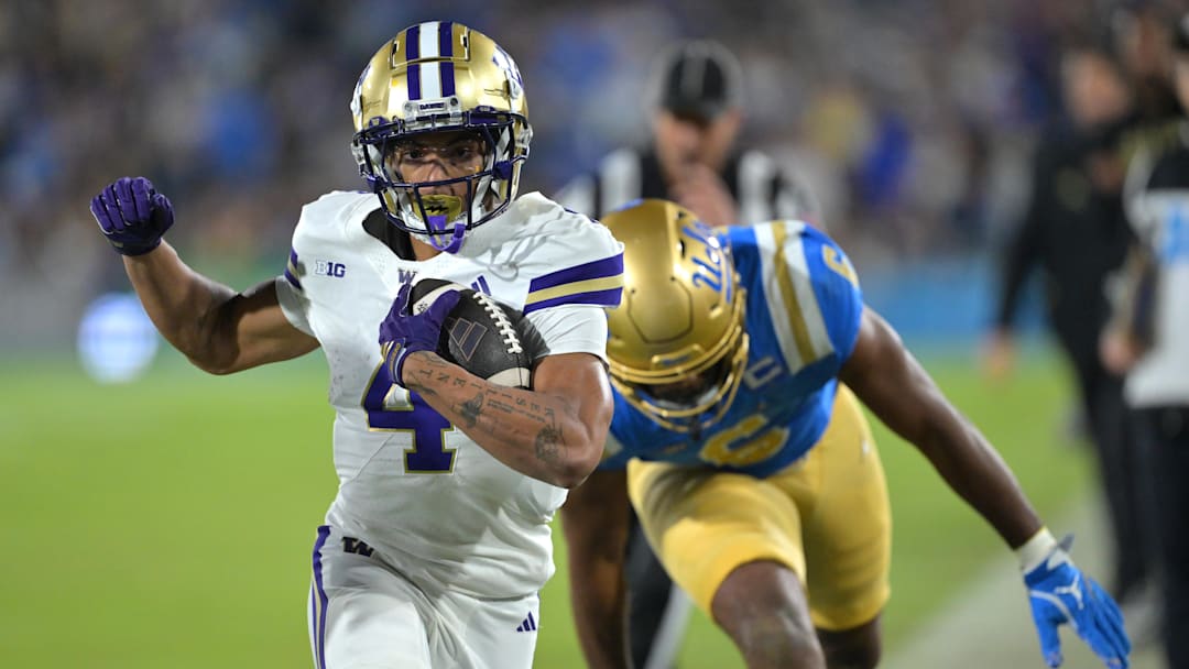 Nov 22, 2025; Pasadena, California, USA; Washington Huskies running back Jordan Washington (4) is forced out of bounds after a 9-yard gain during the first half against the UCLA Bruins at the Rose Bowl. Mandatory Credit: Jayne Kamin-Oncea-Imagn Images Nov 22, 2025; Pasadena, California, USA; Washington Huskies running back Jordan Washington (4) is forced out of bounds after a 9-yard gain during the first half against the UCLA Bruins at the Rose Bowl. Mandatory Credit: Jayne Kamin-Oncea-Imagn Images