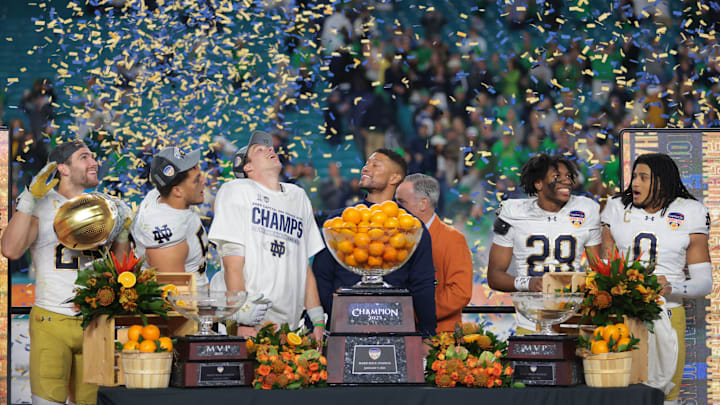 Notre Dame Fighting Irish head coach Micah Shrewsberry and quarterback Riley Leonard (13) celebrates defeating the Penn State Nittany Lions in the Orange Bowl at Hard Rock Stadium. Notre Dame Fighting Irish head coach Micah Shrewsberry and quarterback Riley Leonard (13) celebrates defeating the Penn State Nittany Lions in the Orange Bowl at Hard Rock Stadium.