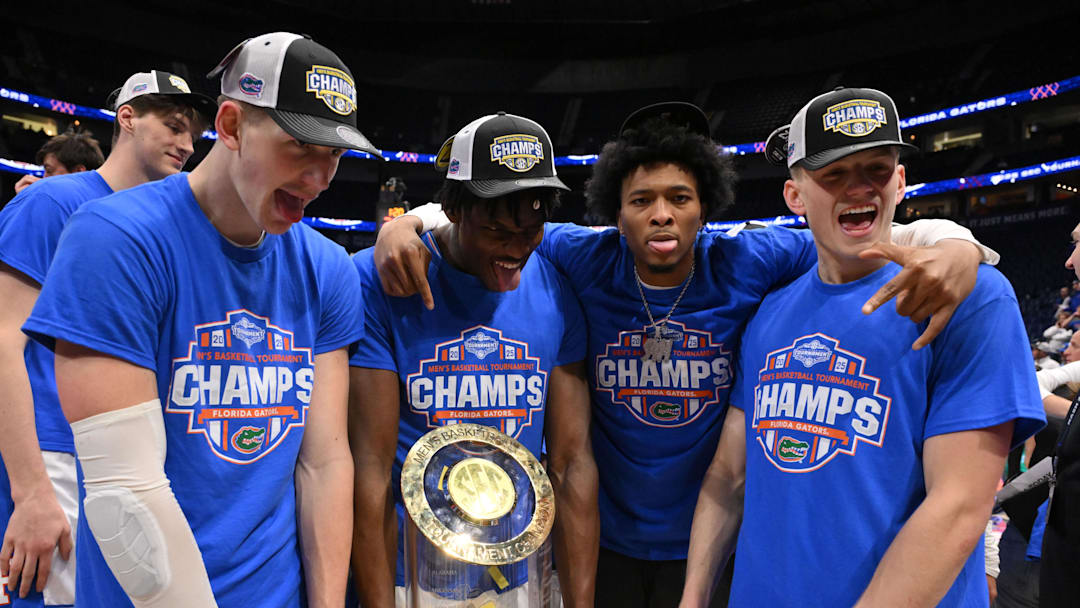 Mar 16, 2025; Nashville, TN, USA; The Florida Gators celebrate after defeating the Tennessee Volunteers in the 2025 SEC Championship Game at Bridgestone Arena. Mandatory Credit: Steve Roberts-Imagn Images