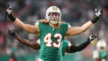 Miami Dolphins linebacker Andrew Van Ginkel (43) and linebacker David Long Jr., rear, celebrate a sack against the Dallas Cowboys during the first half of an NFL game at Hard Rock Stadium in Miami Gardens, Dec. 24, 2023.