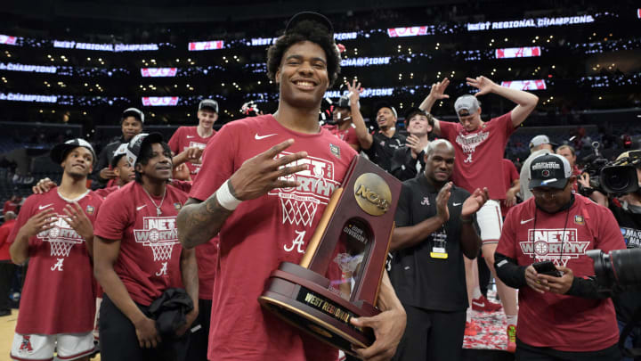 Mar 30, 2024; Los Angeles, CA, USA; Alabama Crimson Tide forward Nick Pringle (23) celebrates with the trophy after defeating the Clemson Tigers in the finals of the West Regional of the 2024 NCAA Tournament at Crypto.com Arena. Mandatory Credit: Jayne Kamin-Oncea-USA TODAY Sports