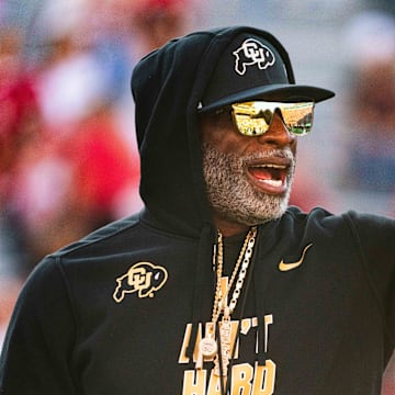 Sep 7, 2024; Lincoln, Nebraska, USA; Colorado Buffaloes head coach Deion Sanders watches warmups before the game against the Nebraska Cornhuskers at Memorial Stadium. Mandatory Credit: Dylan Widger-Imagn Images