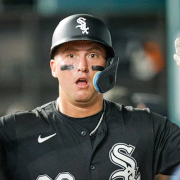 Jul 23, 2024; Arlington, Texas, USA; Chicago White Sox catcher Korey Lee (26) slaps hands in the dugout after scoring a run in the third inning against the Texas Rangers at Globe Life Field.