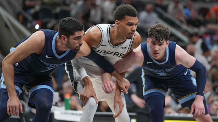 Mar 22, 2024; San Antonio, Texas, USA; Memphis Grizzlies forward Santi Aldama (7) boxes out San Antonio Spurs center Victor Wembanyama (1)