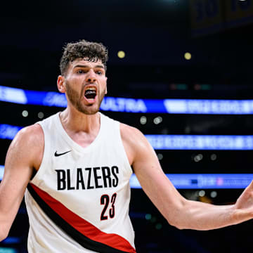 Oct 27, 2025; Los Angeles, California, USA; Portland Trail Blazers center Donovan Clingan (23) reacts during the first half against the Los Angeles Lakers at Crypto.com Arena. Mandatory Credit: William Liang-Imagn Images