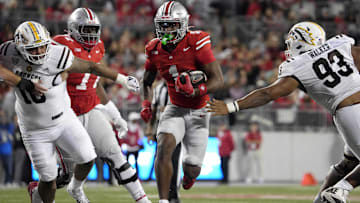 Sept. 7, 2024; Columbus, Ohio, USA;Ohio State Buckeyes running back Quinshon Judkins (1) finds a hole between Western Michigan Broncos defensive lineman Isaiah Green (10) and defensive lineman Corey Walker (93) during the first half at Ohio Stadium.