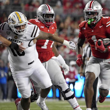 Sept. 7, 2024; Columbus, Ohio, USA;Ohio State Buckeyes running back Quinshon Judkins (1) finds a hole between Western Michigan Broncos defensive lineman Isaiah Green (10) and defensive lineman Corey Walker (93) during the first half at Ohio Stadium.