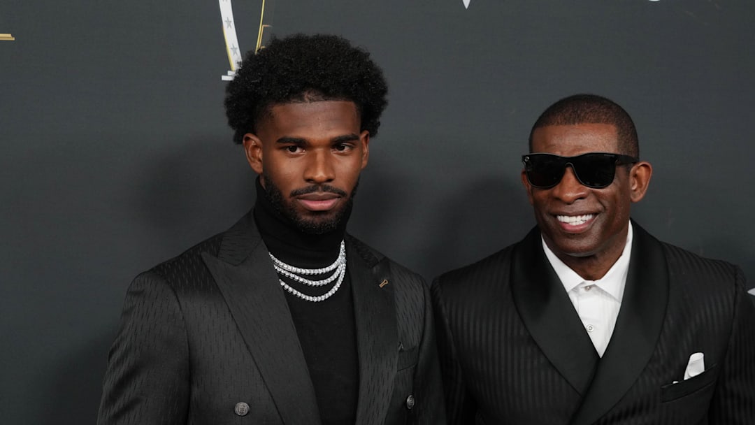 Feb 6, 2025; New Orleans, LA, USA;  Deion Sanders (right) with his son Shedeur Sanders on the red carpet before Super Bowl LIX NFL Honors at Saenger Theatre. Mandatory Credit: Kirby Lee-Imagn Images