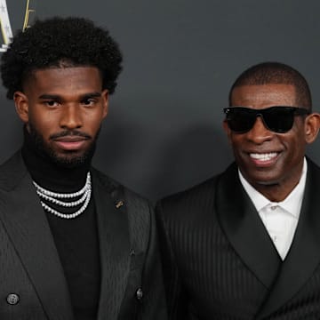 Sanders with his son Shedeur Sanders before the NFL Honors at Saenger Theatre. 
