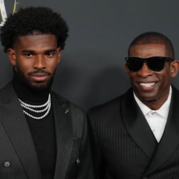 Deion Sanders with his son Shedeur Sanders on the red carpet before Super Bowl LIX NFL Honors.