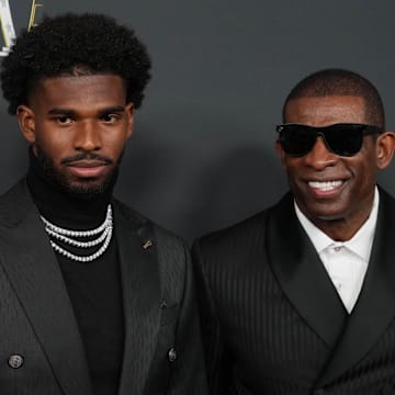 Feb 6, 2025; New Orleans, LA, USA;  Deion Sanders (right) with his son Shedeur Sanders on the red carpet before Super Bowl LIX NFL Honors at Saenger Theatre. Mandatory Credit: Kirby Lee-Imagn Images