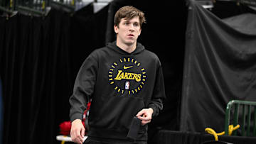 Apr 9, 2025; Dallas, Texas, USA; Los Angeles Lakers guard Austin Reaves (15) walks on to the court before the game between the Dallas Mavericks and the Los Angeles Lakers during the first quarter at the  American Airlines Center. Mandatory Credit: Jerome Miron-Imagn Images
