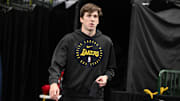 Apr 9, 2025; Dallas, Texas, USA; Los Angeles Lakers guard Austin Reaves (15) walks on to the court before the game between the Dallas Mavericks and the Los Angeles Lakers during the first quarter at the  American Airlines Center. Mandatory Credit: Jerome Miron-Imagn Images
