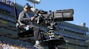 Oct 20, 2024; Green Bay, Wisconsin, USA;  General view of a television camera operator during the game between the Houston Texans and Green Bay Packers at Lambeau Field. Mandatory Credit: Jeff Hanisch-Imagn Images