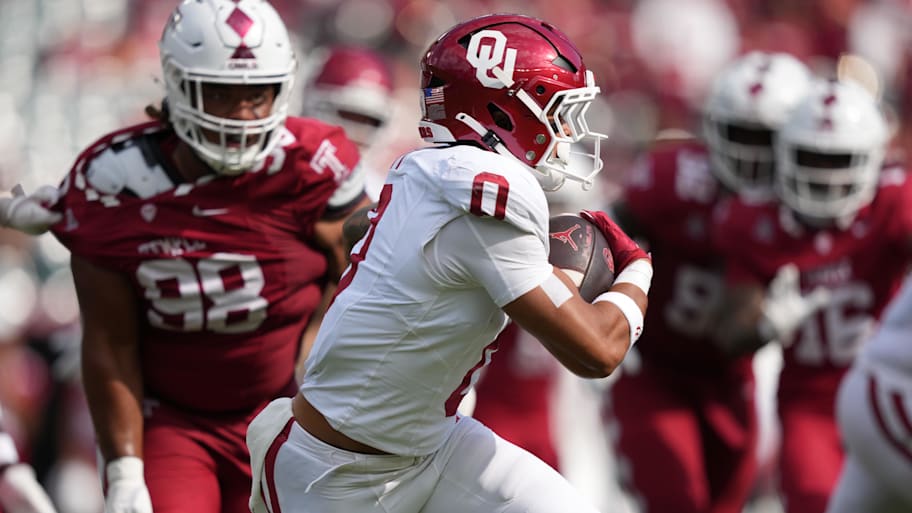 Oklahoma Sooners running back Jaydn Ott (0) rushes against the Temple Owls.