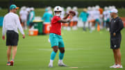 Jul 24, 2024; Miami Gardens, FL, USA; Miami Dolphins quarterback Tua Tagovailoa (1) throws the football at Baptist Health Training Complex during training camp.