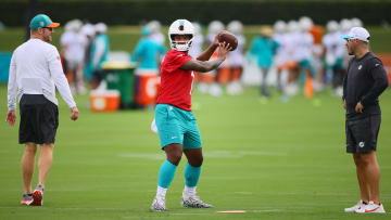 Jul 24, 2024; Miami Gardens, FL, USA; Miami Dolphins quarterback Tua Tagovailoa (1) throws the football at Baptist Health Training Complex during training camp.