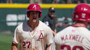 Ryder Helfrick celebrates after hitting a grand slam against the Tennessee Volunteers in the rubber game and series finale. The Razorbacks won 8-4. 