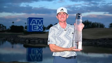 Nick Dunlap poses with the winning trophy at the 2024 edition of The American Express