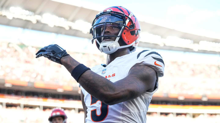 Cincinnati Bengals wide receiver Tee Higgins (5) runs through the end zone on a touchdown reception in the first quarter of the NFL Preseason Week 1 game between the Cincinnati Bengals and the Tampa Bay Buccaneers at Paycor Stadium in downtown Cincinnati on Saturday, Aug. 10, 2024.